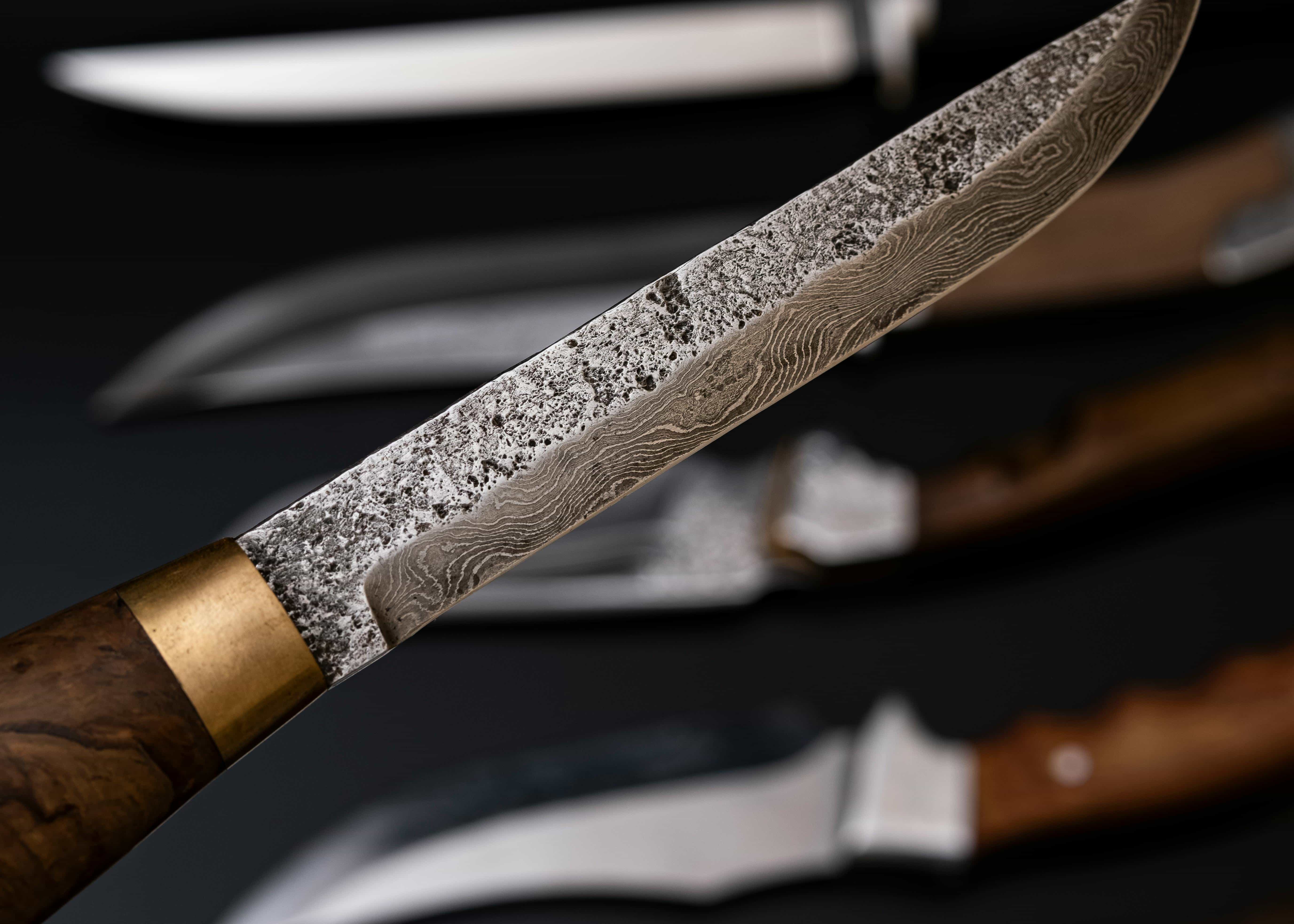 Custom knives handmade by Ukrainian craftsmen from high-quality steel.