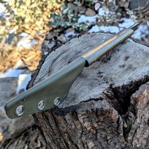 “Handle close-up of the Mavka Kiridashi showing G10 scales in coyote, olive, ivory or bog oak wood.”
