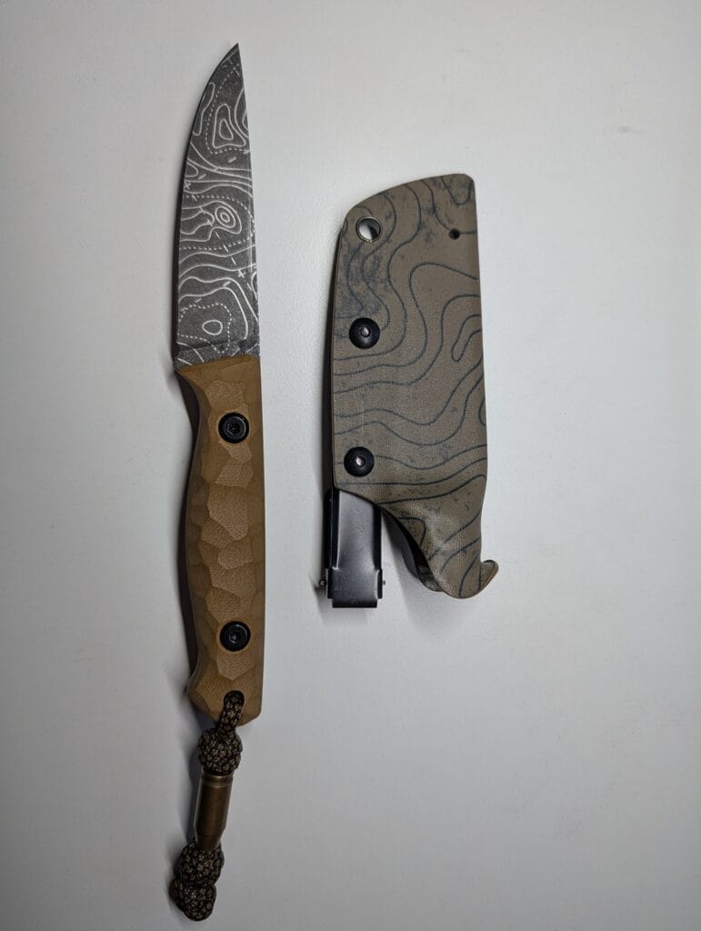 Moskit Knife by Chinush Knives — Topographic Blade Detail Moskit knife with etched topographic blade and sculpted G10 handle handmade by Chinush Knives.