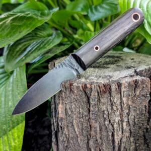 “Mowgli knife in a handcrafted black leather sheath designed for neck carry.”