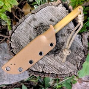 Handle close-up of the Mr Wick handmade knife featuring ergonomic grip and G10 or bog oak scales.