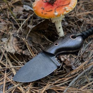 “Close-up of the Scarab knife handle made from natural bog oak.”