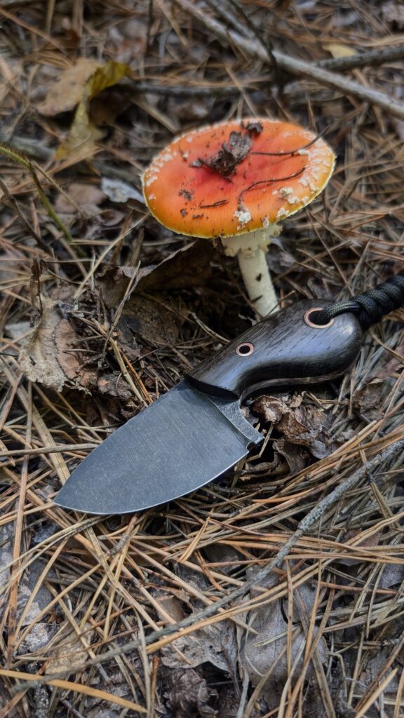 “Close-up of the Scarab knife handle made from natural bog oak.”