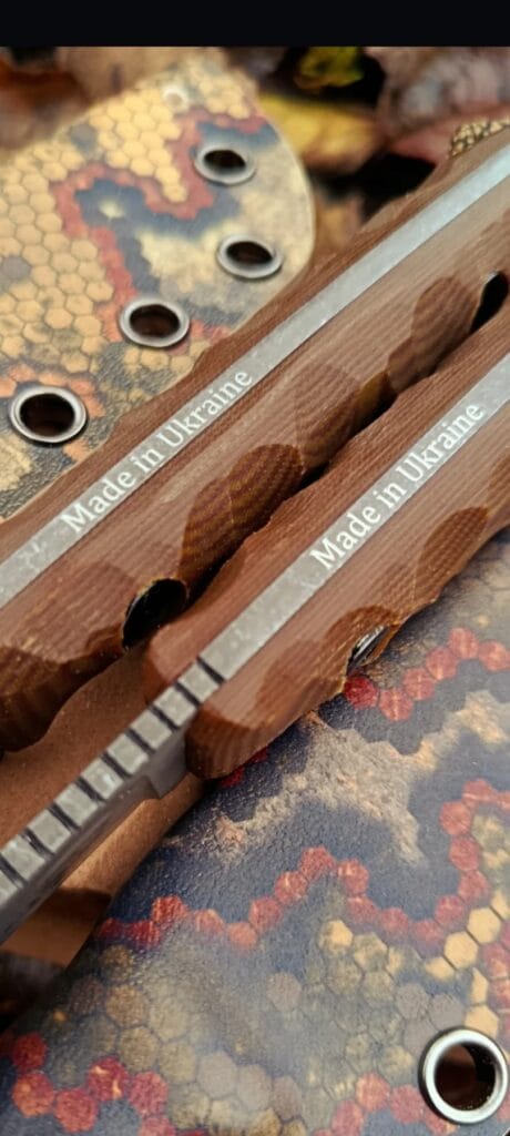 handmade knife maker in workshop preparing blade for heat treatment