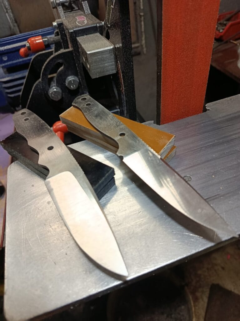 preparing a handmade knife blade for heat treatment in a workshop